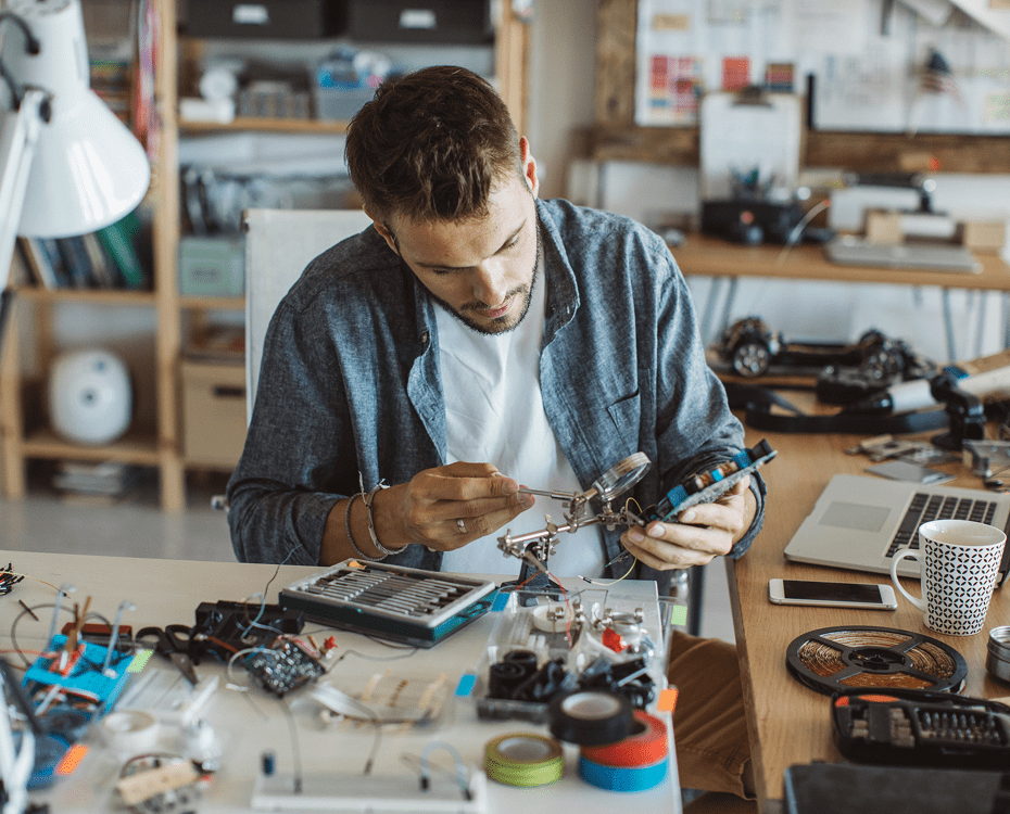 Man working on electronics at desk